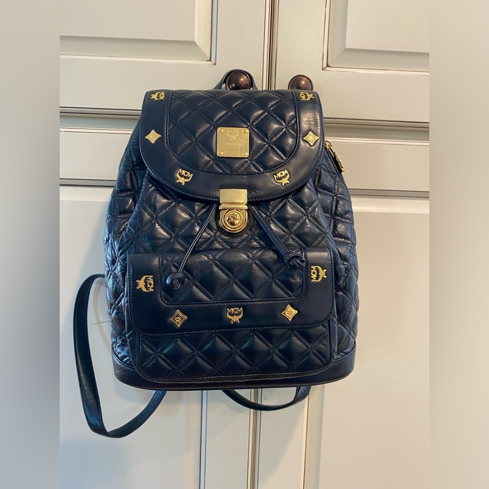 MCM Black Backpack with Gold Hardware 
Comes with the dust bag
